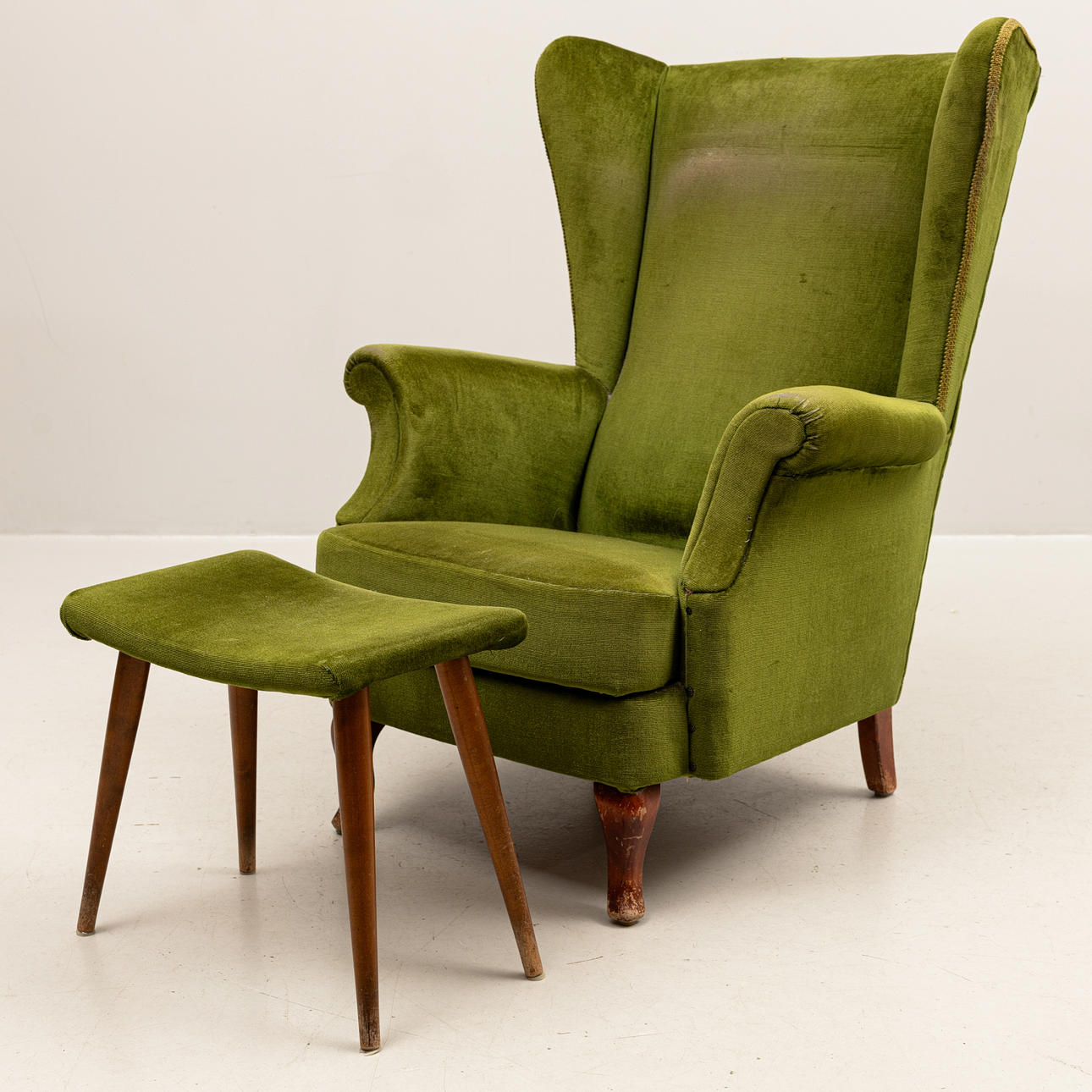 EAR-PATCH ARMCHAIR WITH FOOTSTOOL, 1950'S.