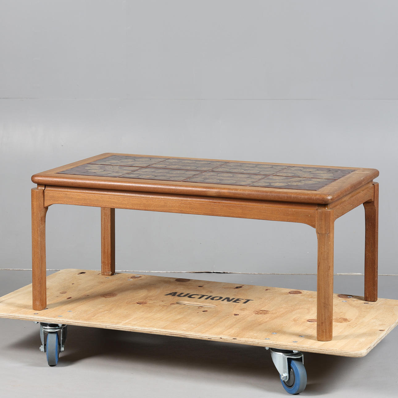 NATHAN FURNITURE. A TILE TOP COFFEE TABLE.