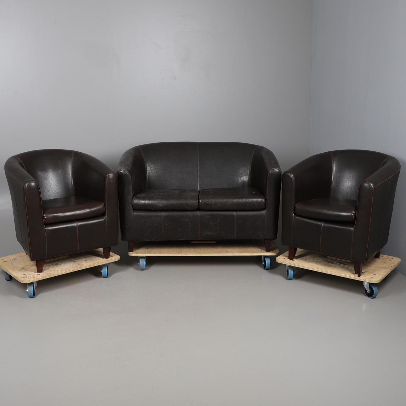 A HIDE COVERED THREE PIECE SUITE.