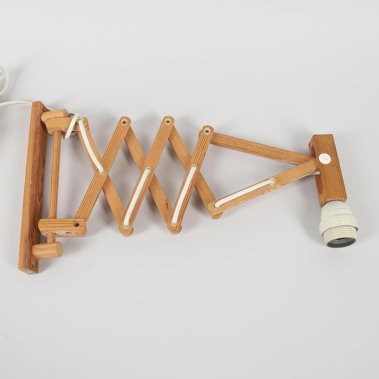 A pine wall mounted scissor lamp, 20th century.