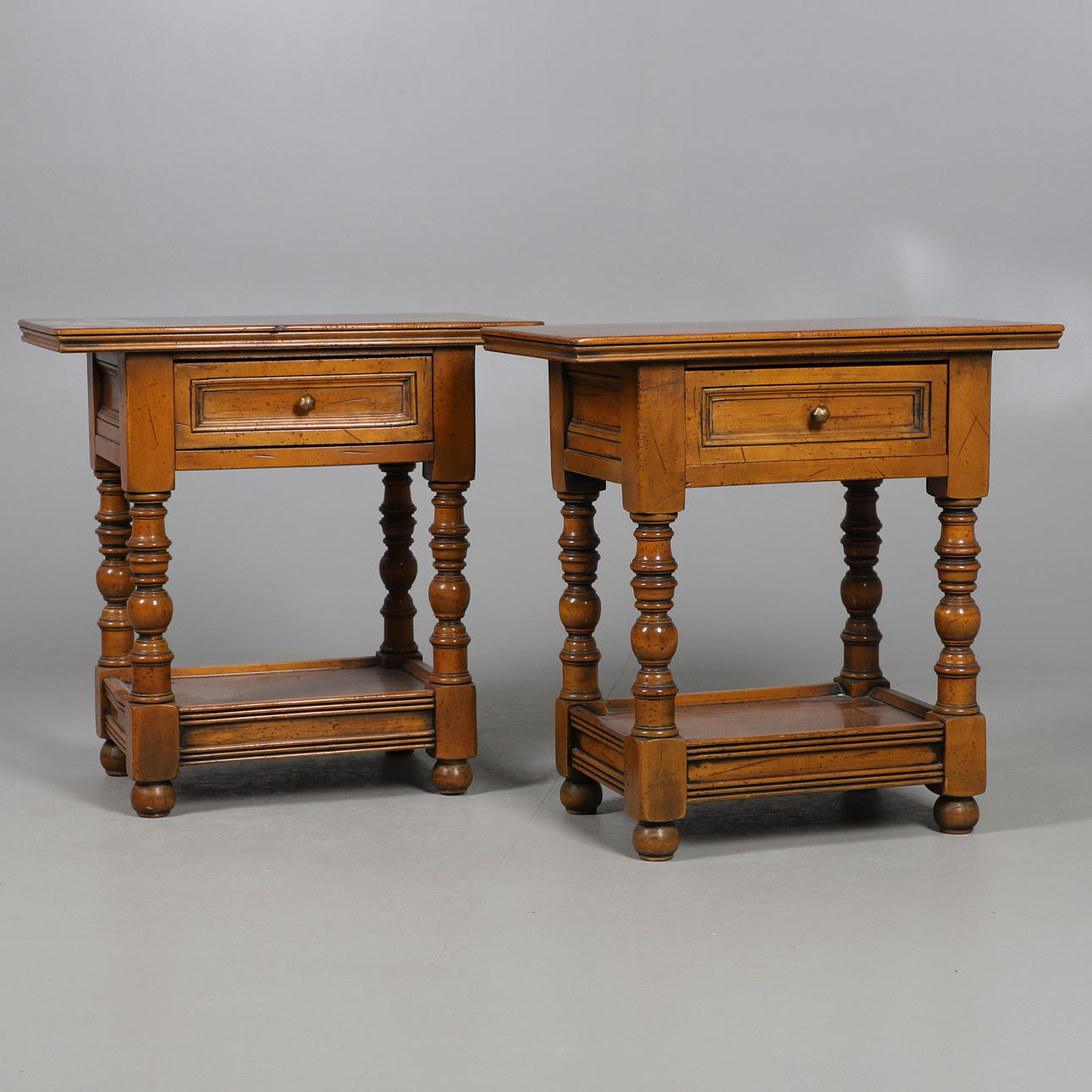 A PAIR OF MANGO WOOD BEDSIDE TABLES.