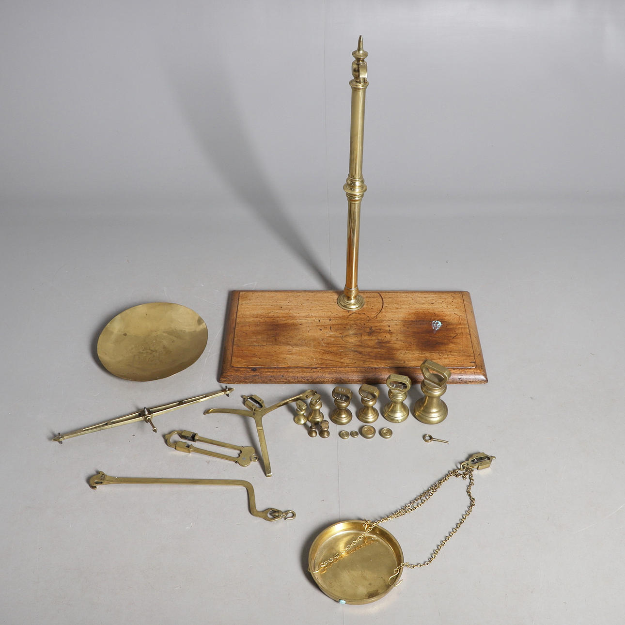 A SET OF BRASS BALANCE SCALES AND WEIGHTS.