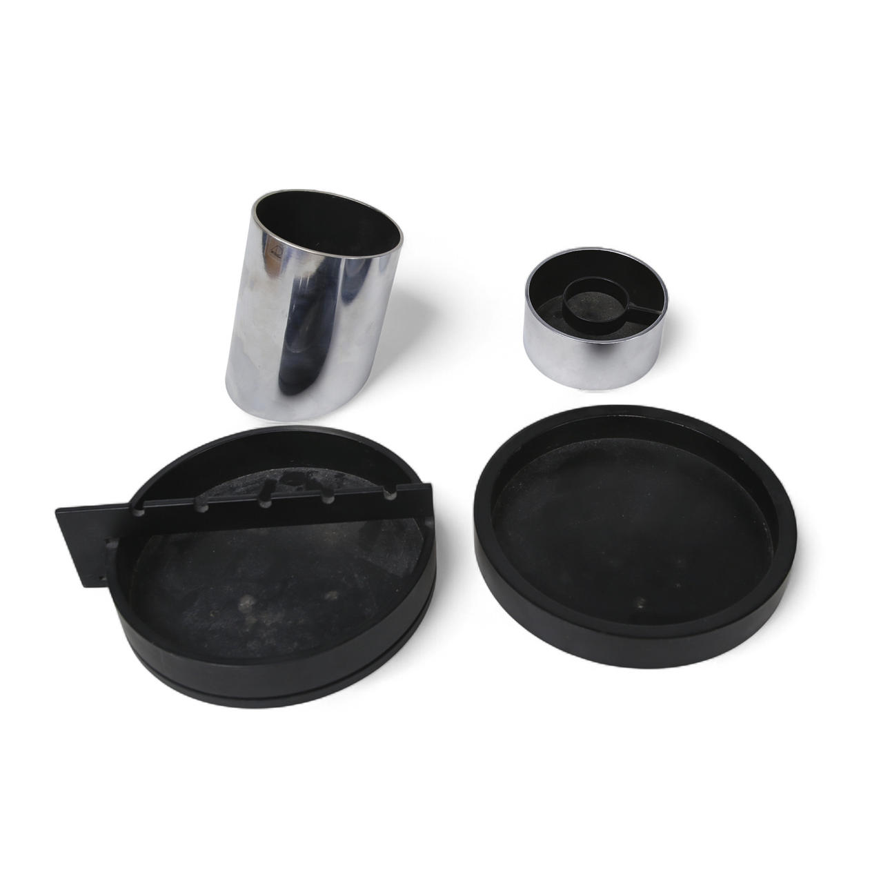 GILBERT MARKLUND, Candle lantern and container, chromed steel for Art Design and two round bowl dishes, cast iron, Art Design.
