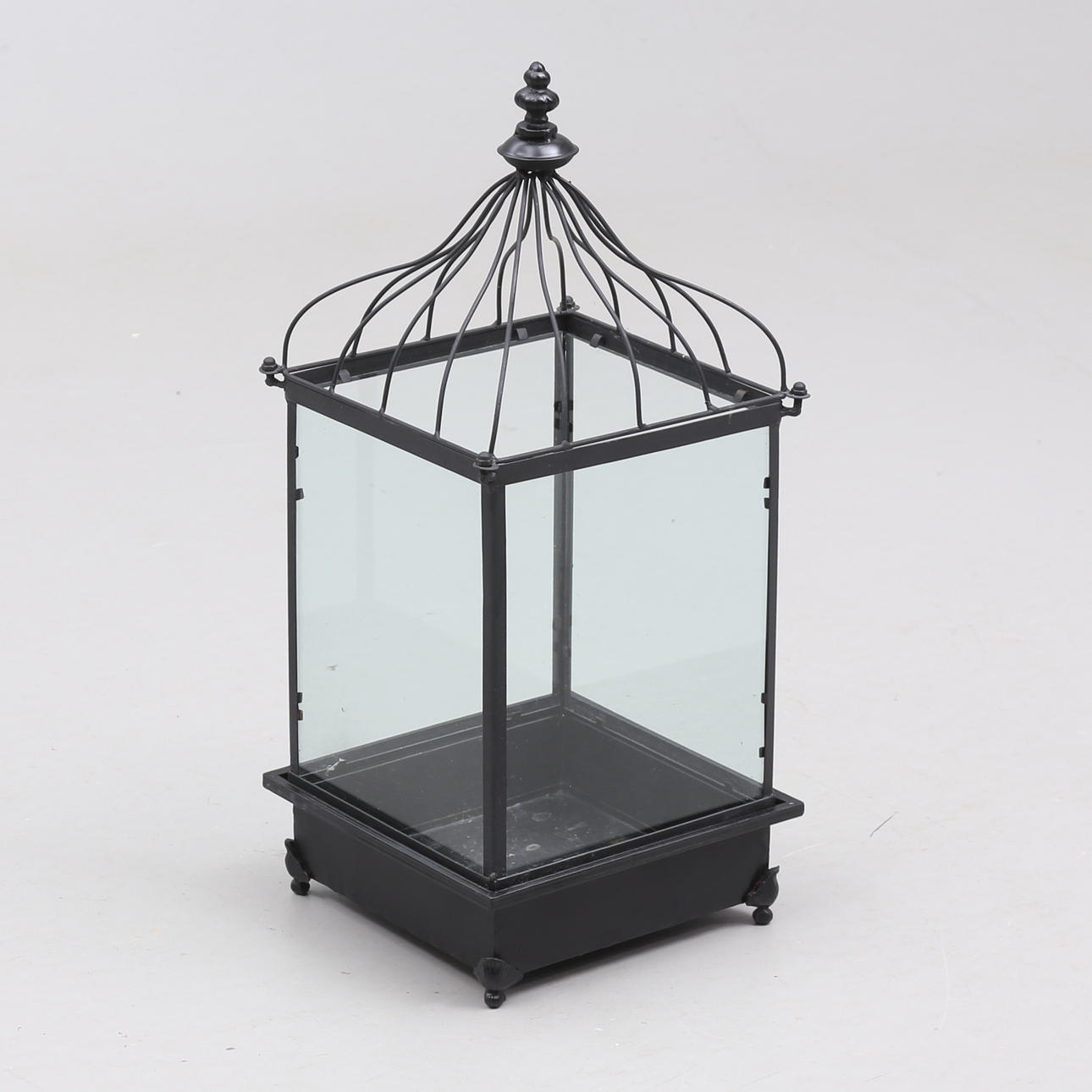 A contemporary metal/glass lantern.