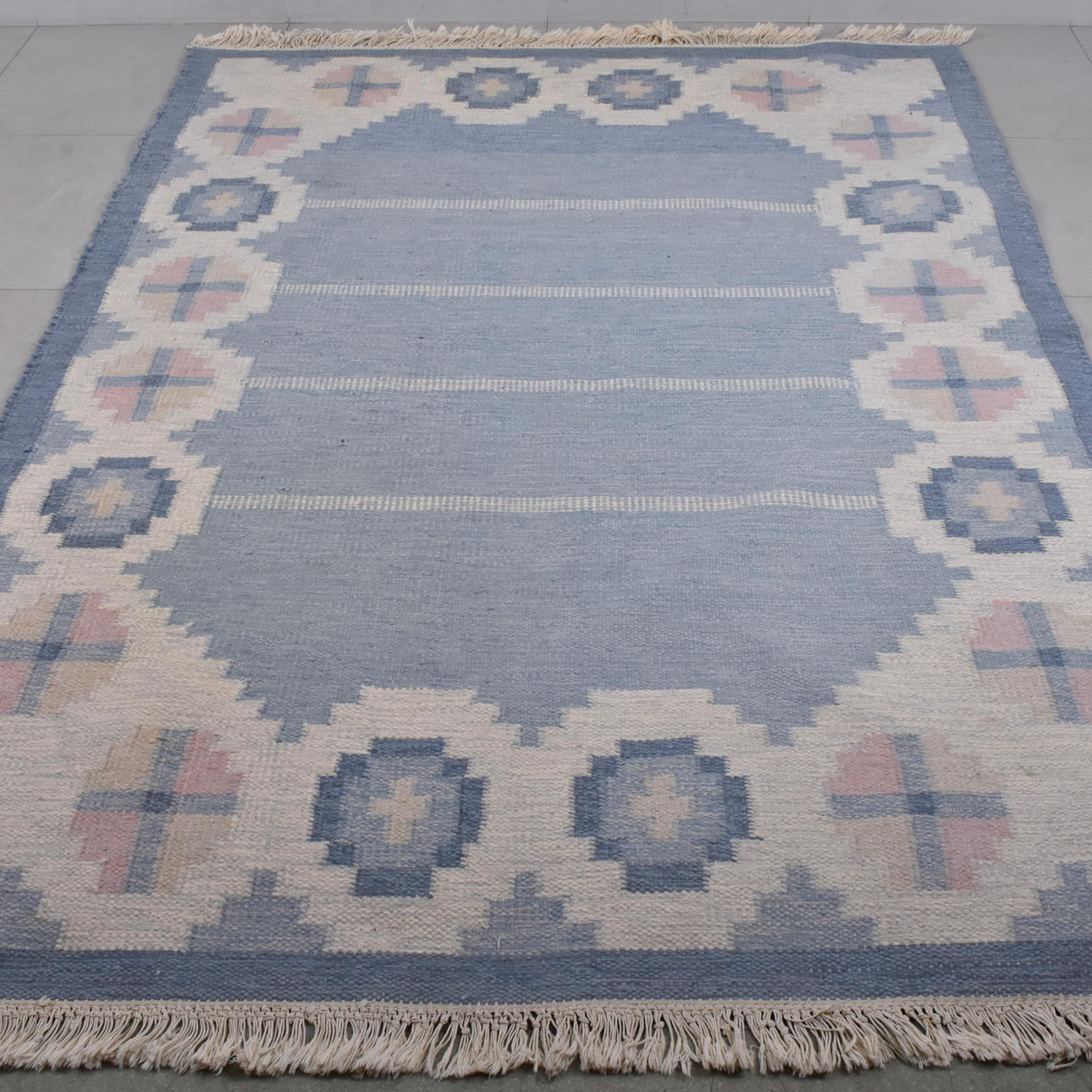 LISELOTTE MALMSTEN. A carpet, wicker, 20th century.