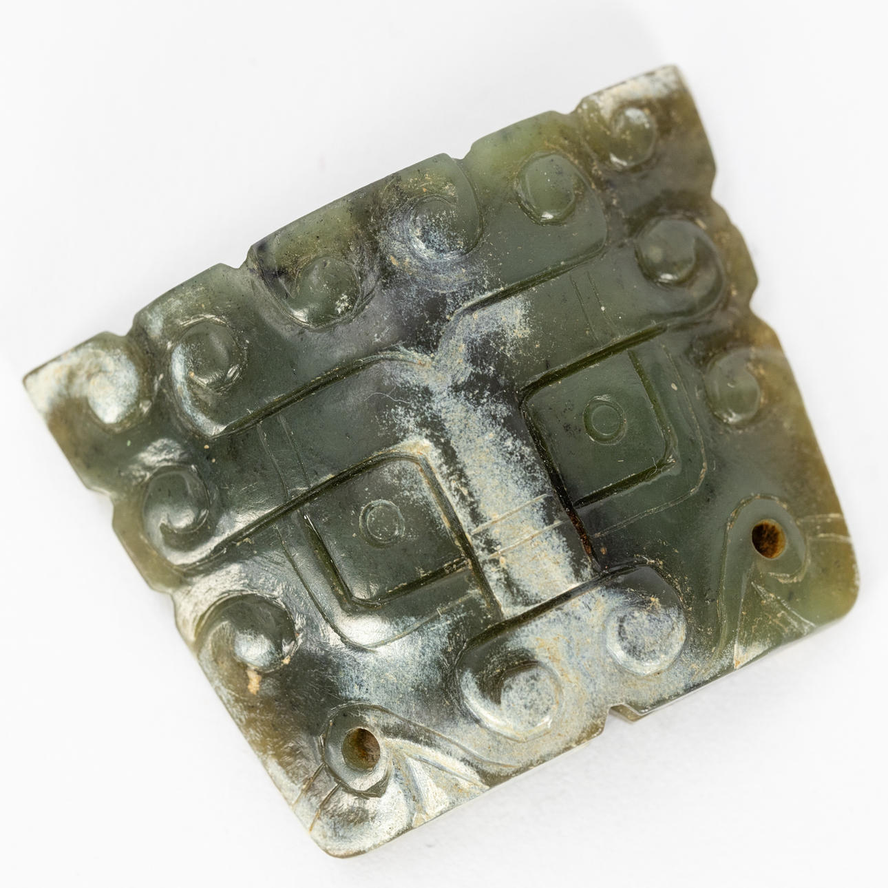 Taotie ornament in archaic style, nephrite jade.