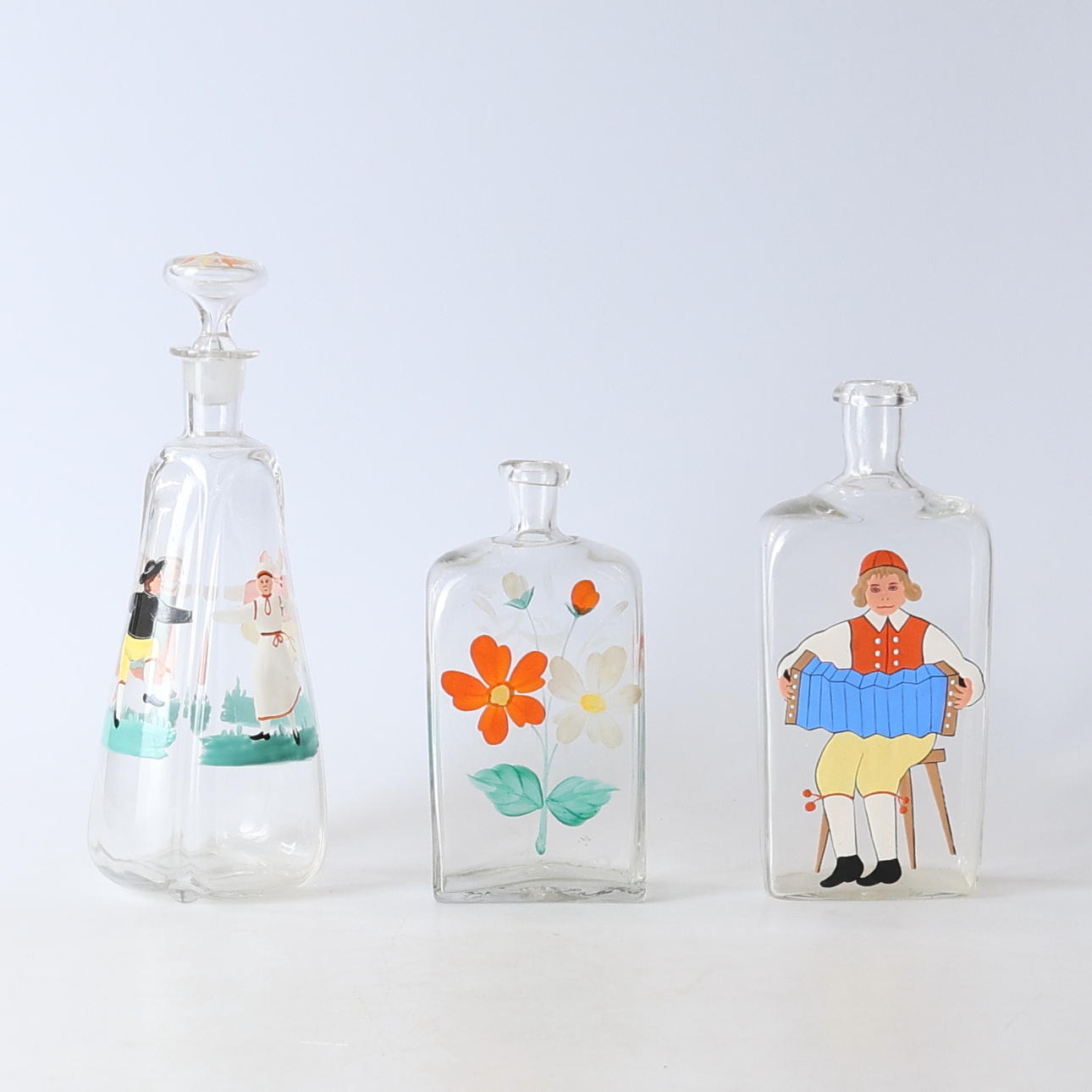 3-teilige Glaskaraffe und Flaschen, 19./20. Jahrhundert.