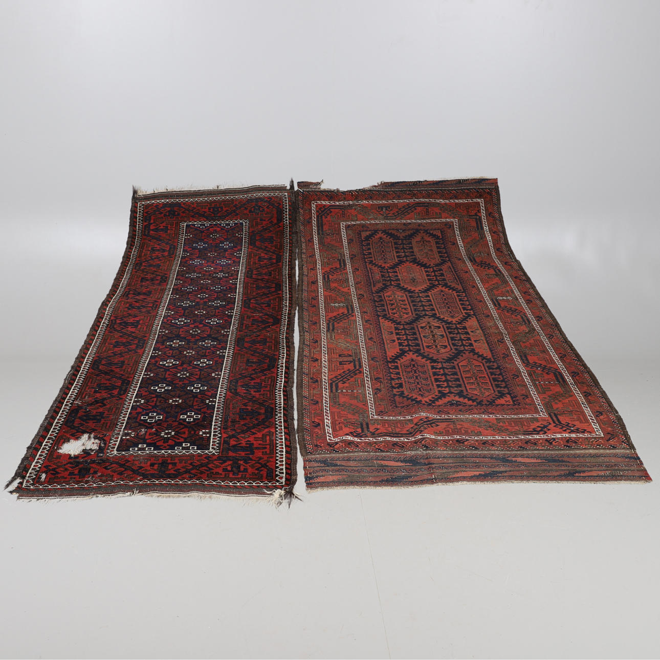 A BALUCH RUG, CIRCA 1900, AND ANOTHER BALUCH.