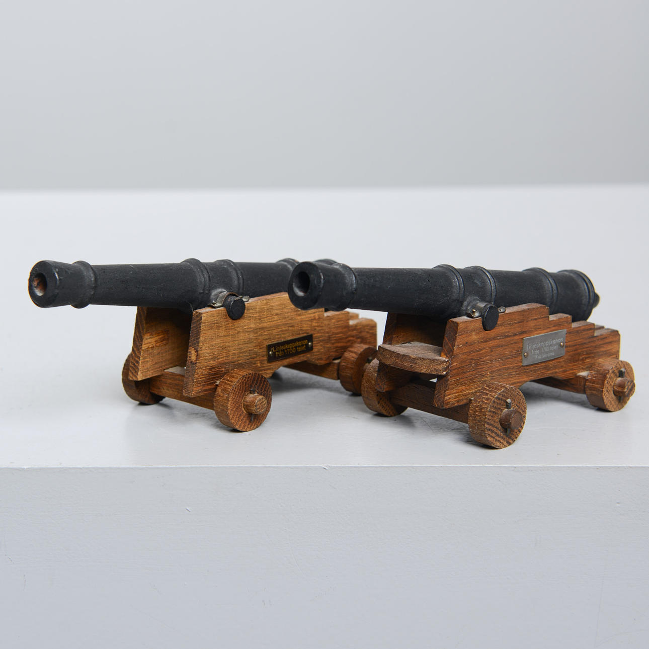 A set of two table guns, after a ship's cannon from the 18th century.