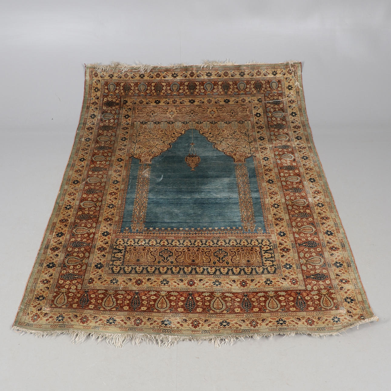A PERSIAN SILK QUM PRAYER RUG.