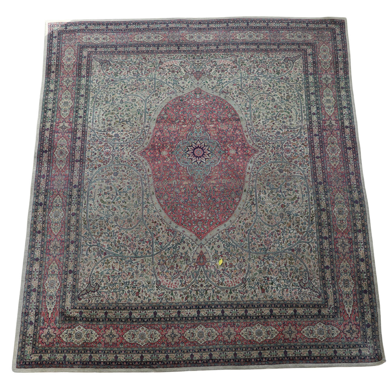 AN EASTERN EUROPEAN PERSIAN DESIGN CARPET.