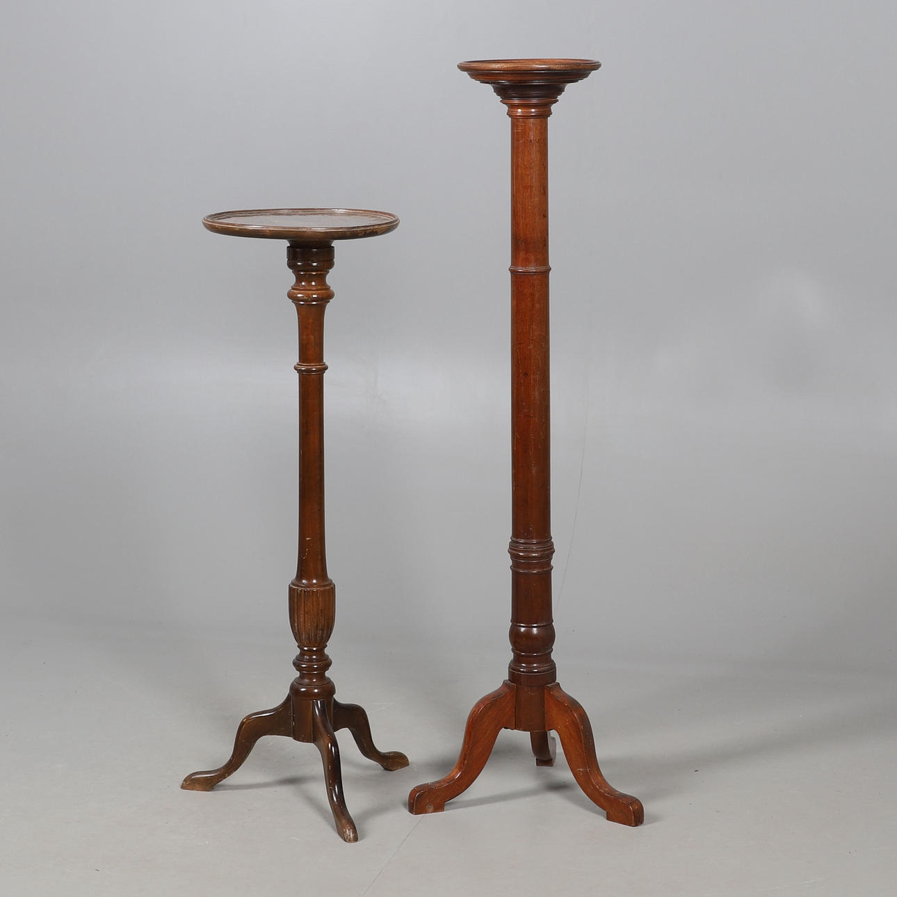 TWO MAHOGANY TORCHÈRES.