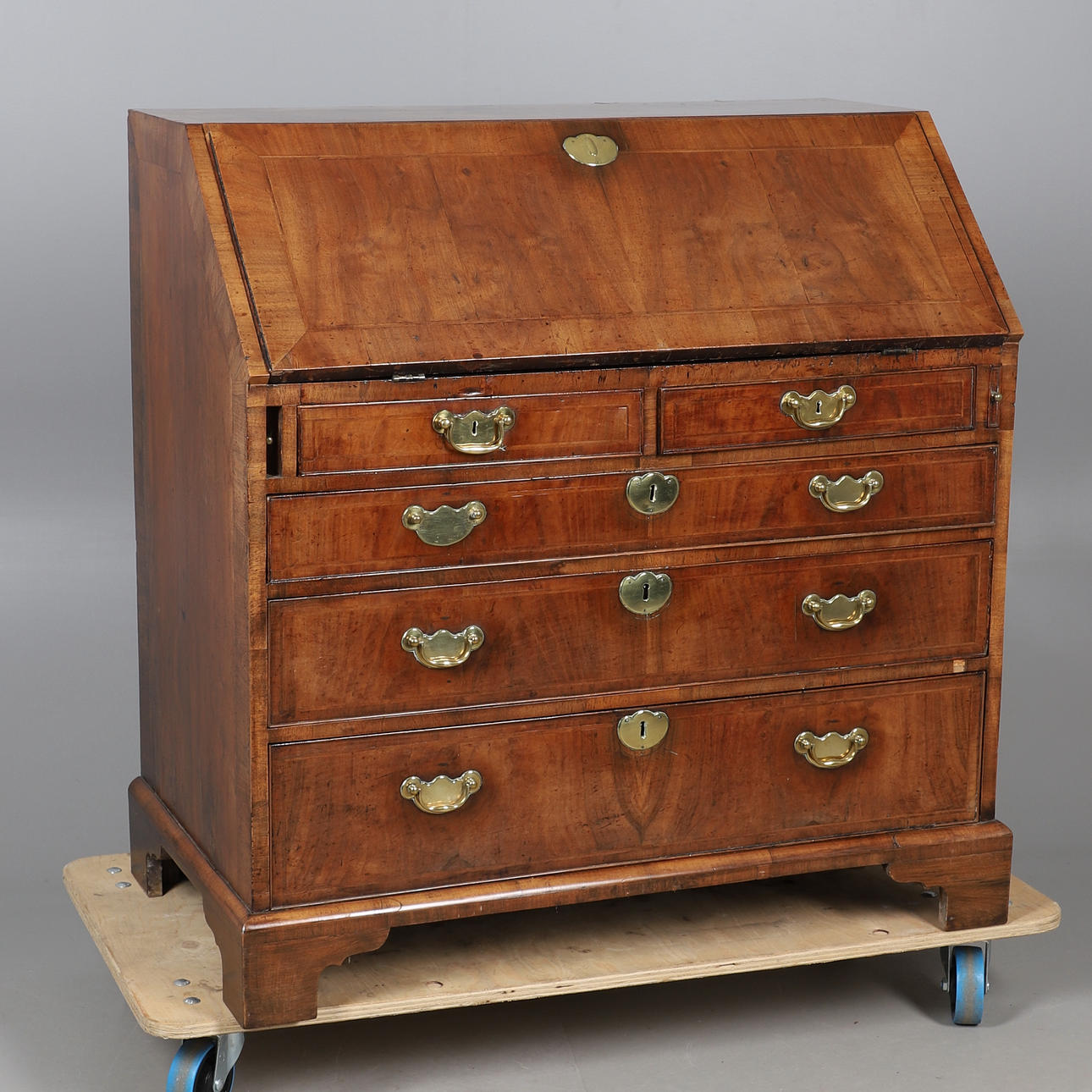 AN EIGHTEENTH CENTURY WALNUT BUREAU.