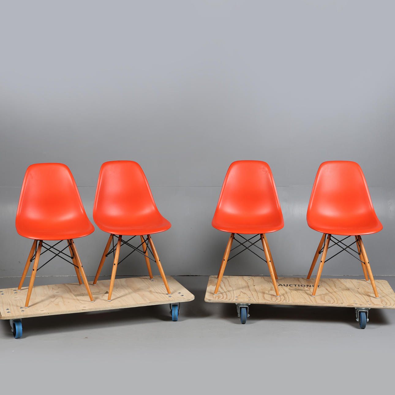 CHARLES & RAY EAMES FOR VITRA. FOUR RED DSW CHAIRS (4).