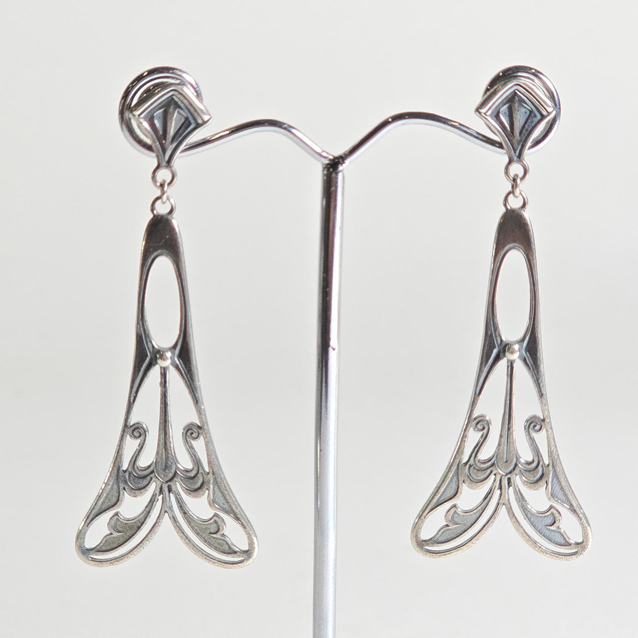 TWO MODERNIST SILVER EARRINGS.