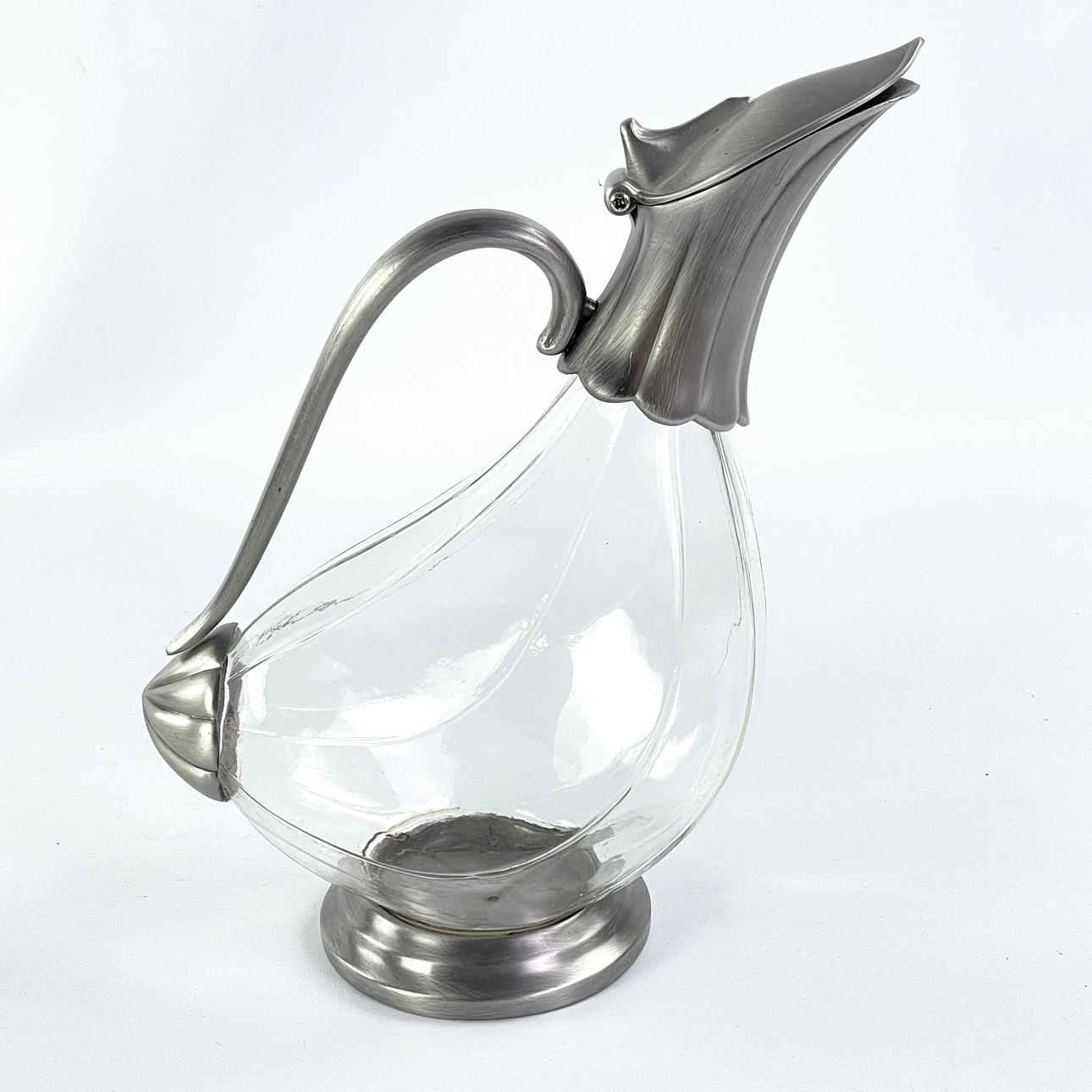 A jug, glass/metal, “Duck”.