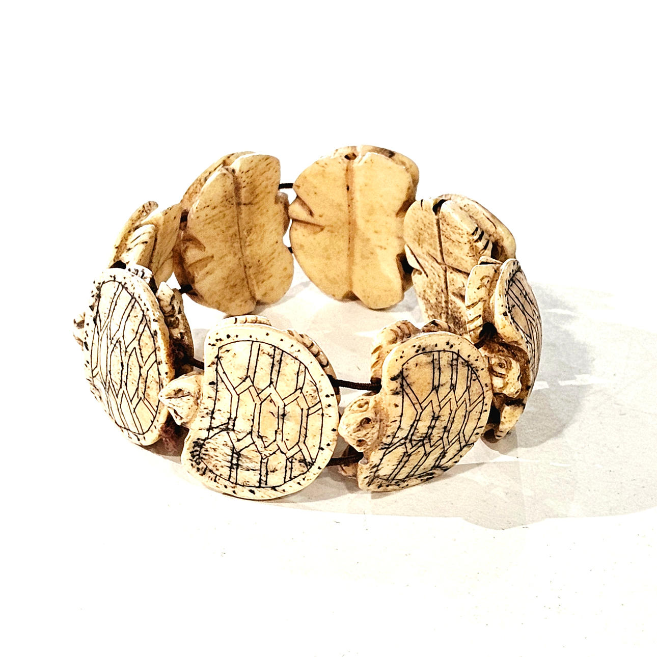 Turtle-like bone bracelet.