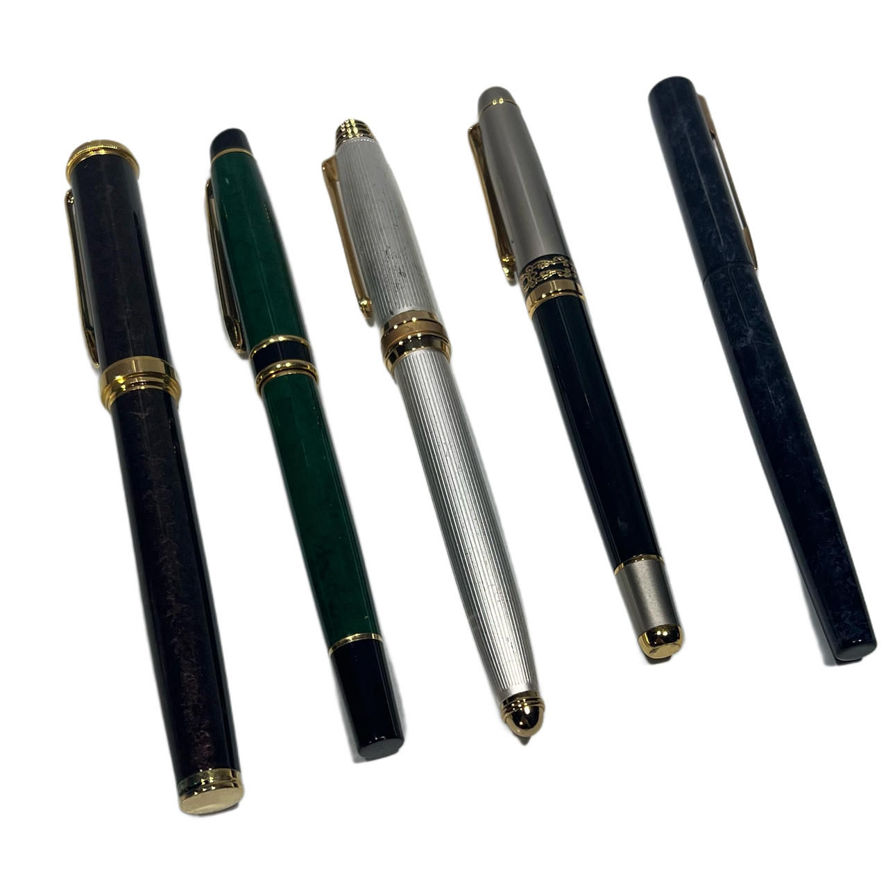 Four collectible pens in different materials.