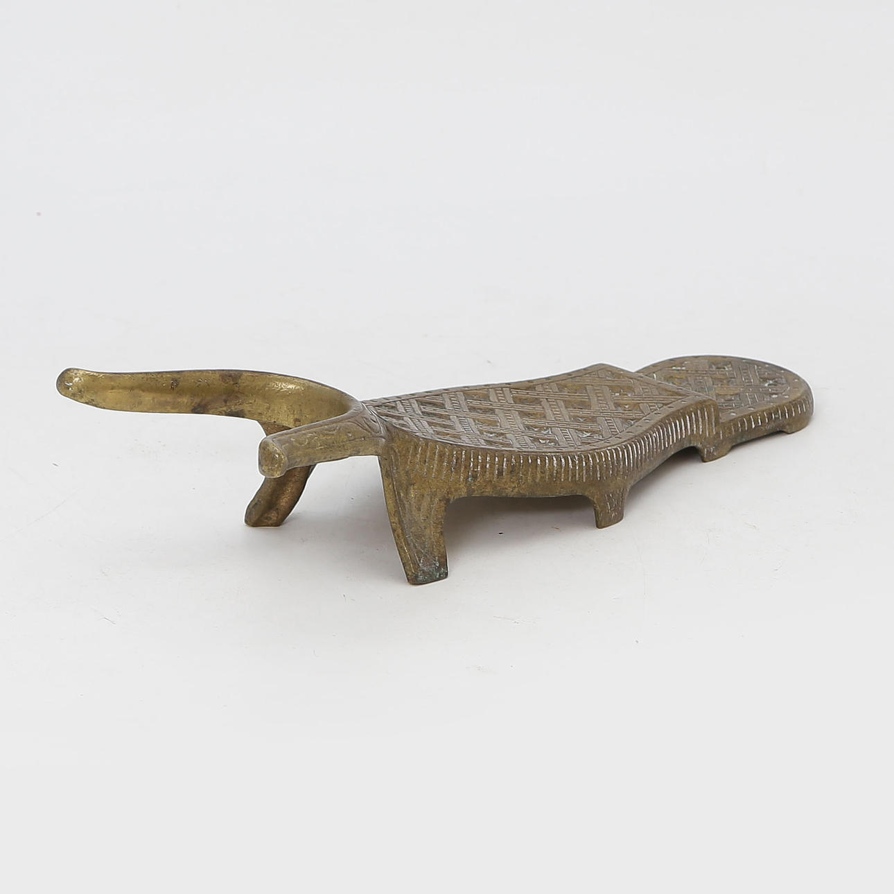 A BRASS BOOT JACK, 20TH CENTURY.