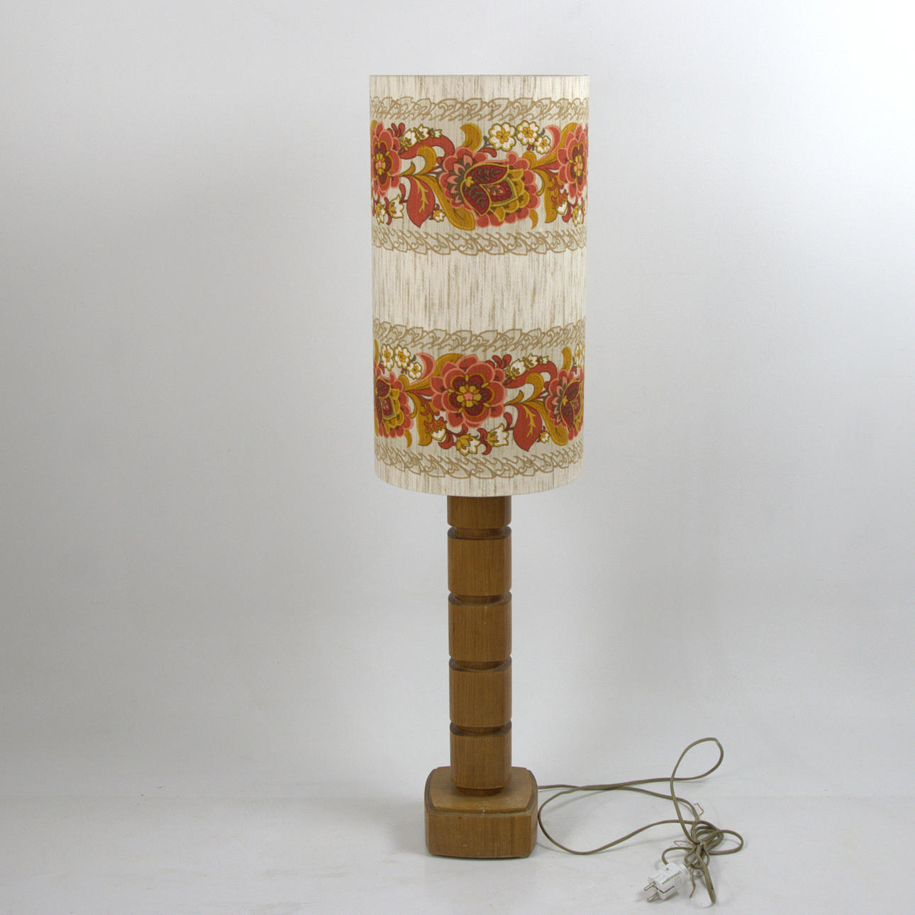 A 1970's teak floor flap, fabric shade.