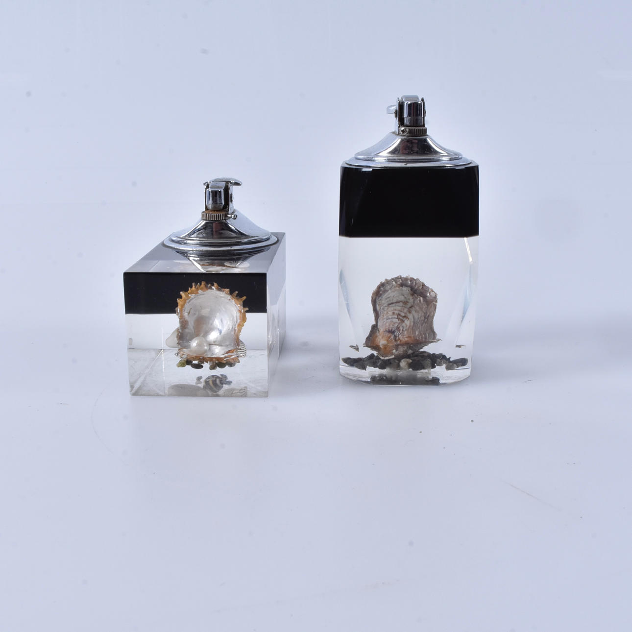 Table lighters with moulded shells, 2 pieces, 20th century.