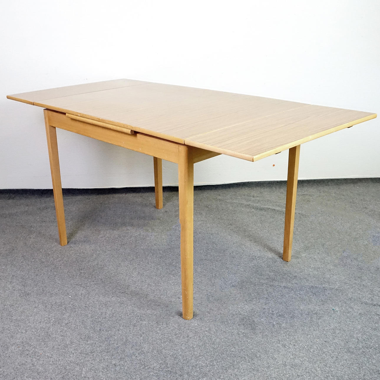 DINING TABLE with Perstorp top and 2 insert plates, mid 20th century.