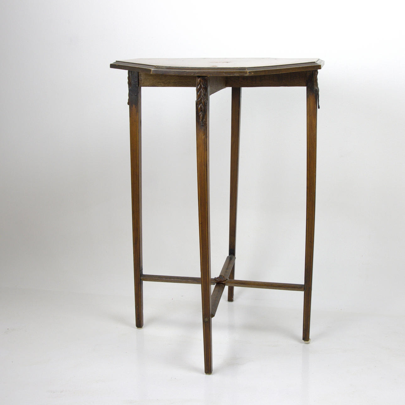A side table, 8-square with connected legs, table top with intarisa, 20th century.