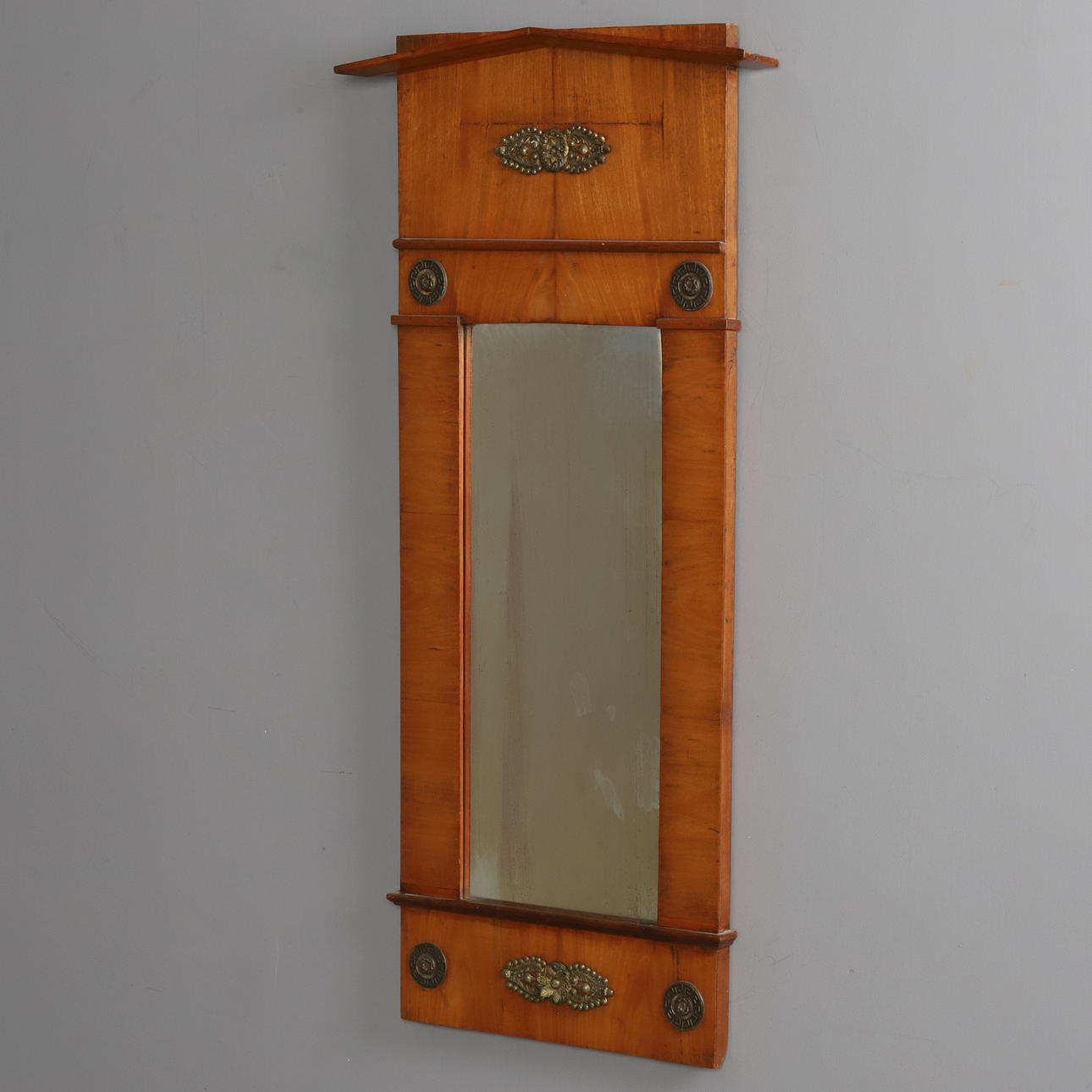 A 19th century Empire style mirror.