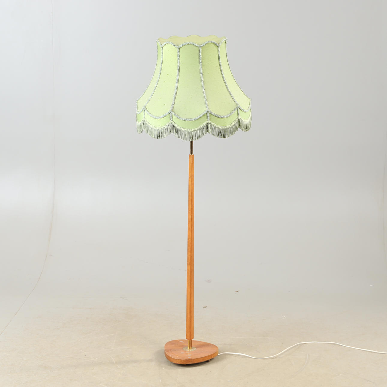 A teak floor lamp, mid 20th century.