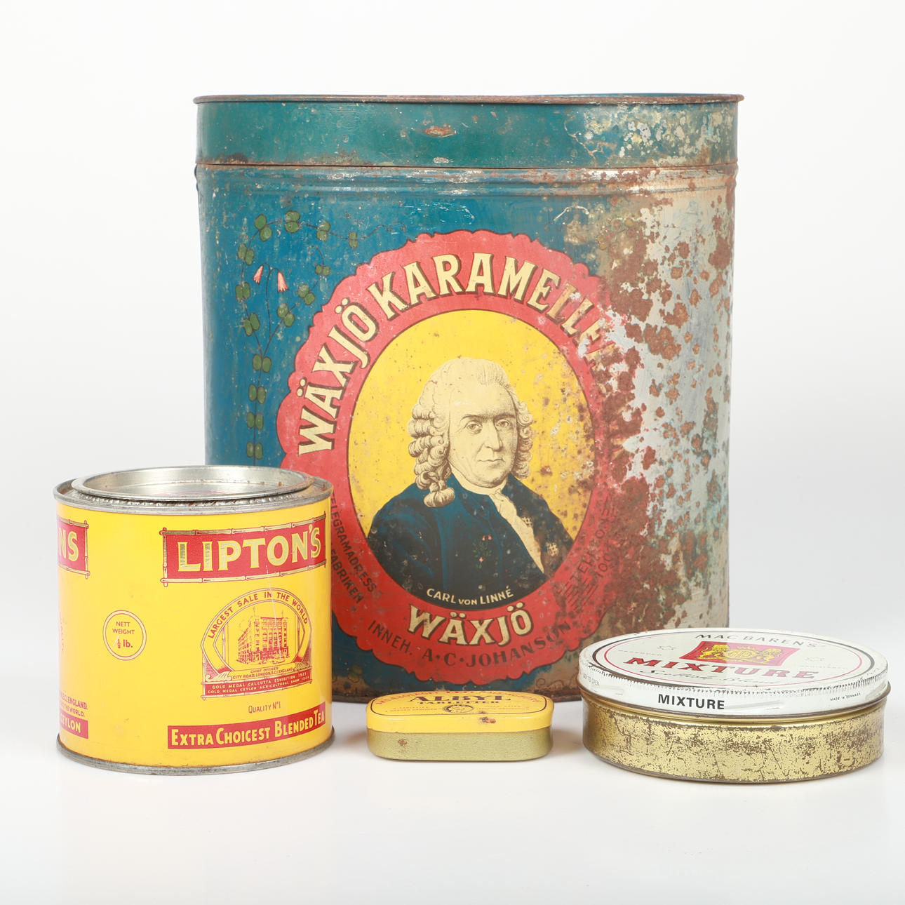 A set of four lithographed tin cans, first half of the 20th century.
