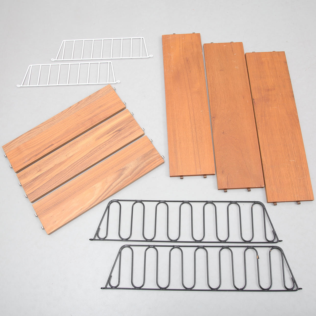 Two teak string shelves, mid 20th century.