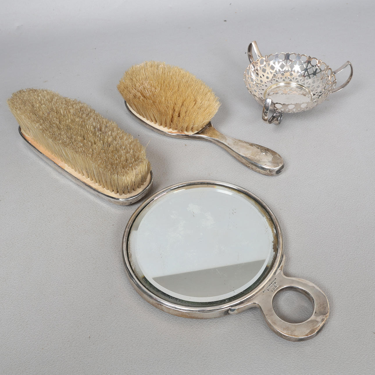 A STERLING SILVER DRESSING TABLE SET, A SILVER PLATED BONBON DISH (4).