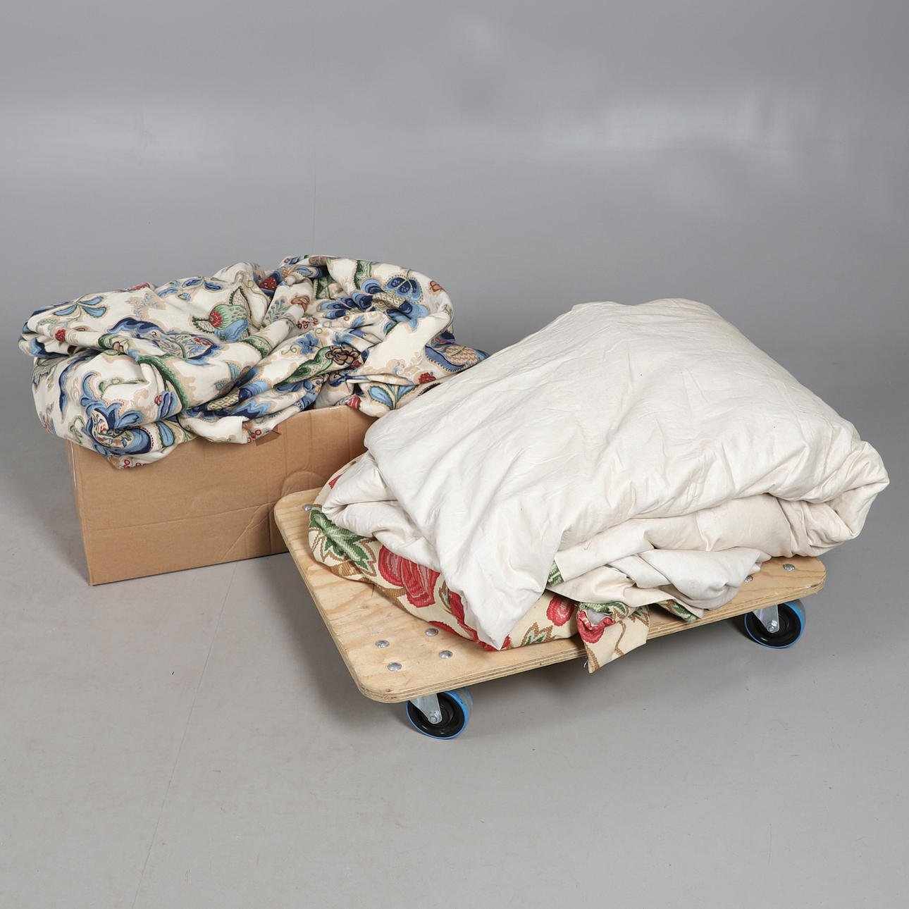 A PAIR OF LINED AND INTERLINED CURTAINS.