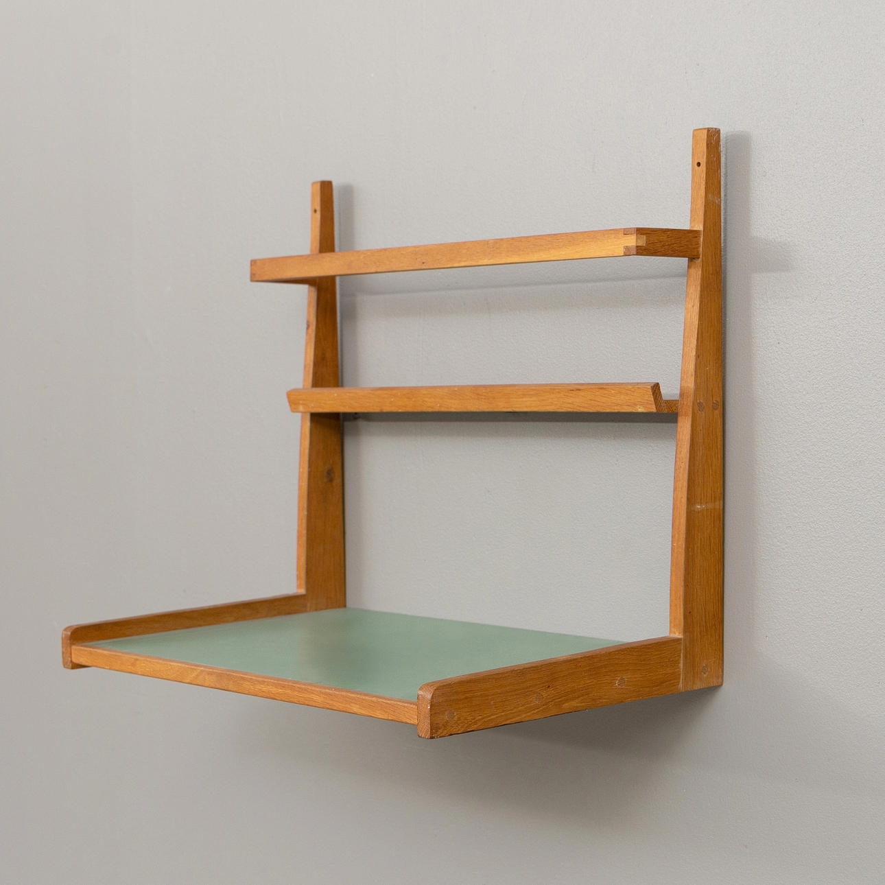 A wall shelf, oak and laminate, 20th century.