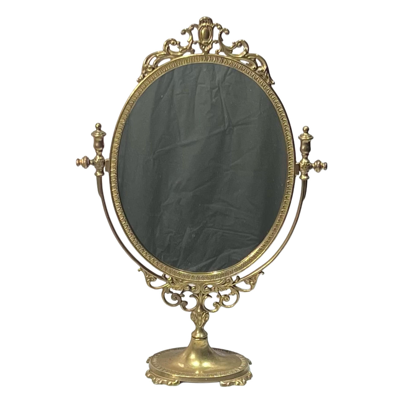 Tilting table mirror in bronze.