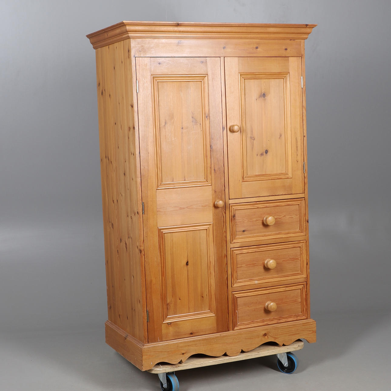 A SMALL PINE WARDROBE.