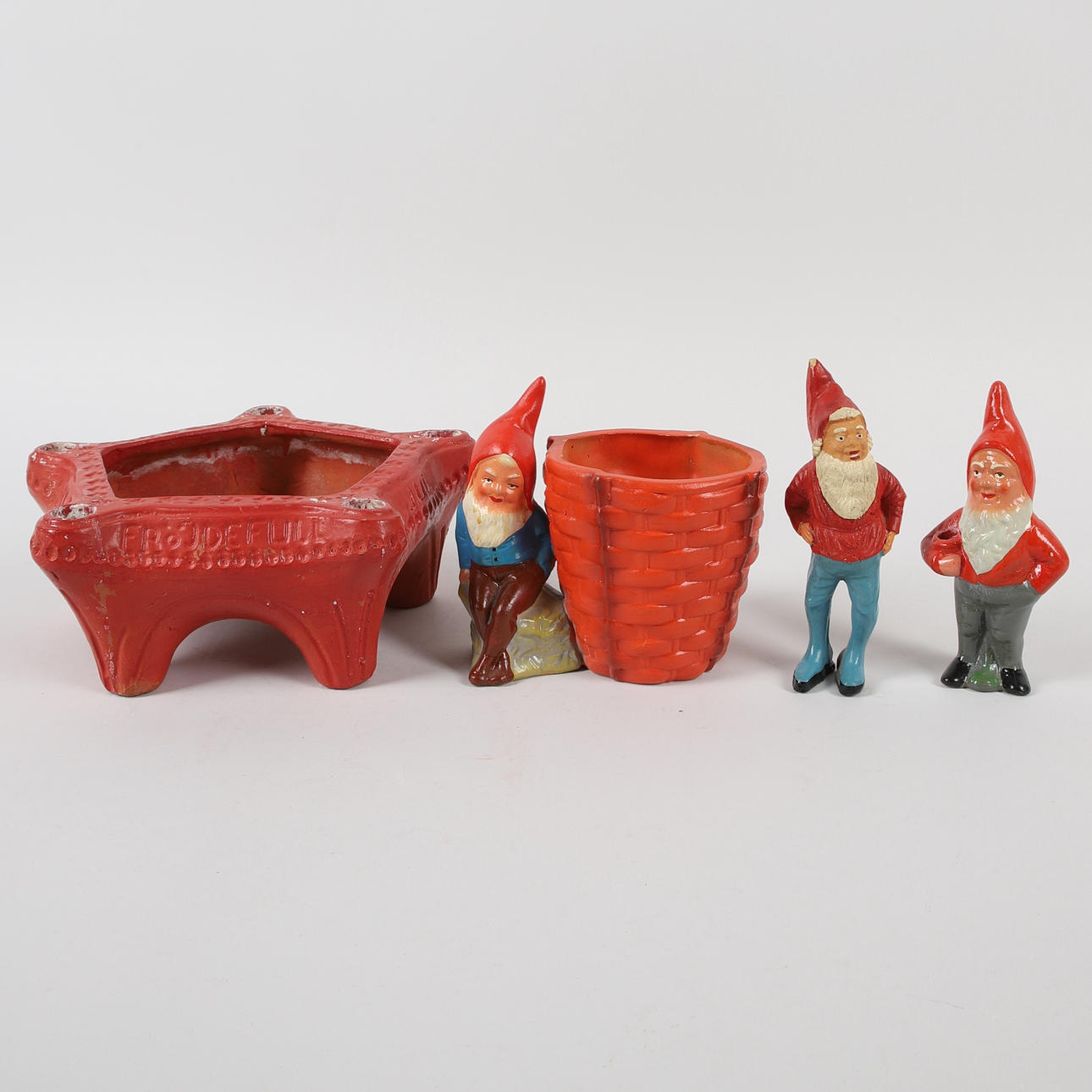 CHRISTMAS OBJECTS, 4 pcs. gnomes, candlestick and outer lining, 20th century.