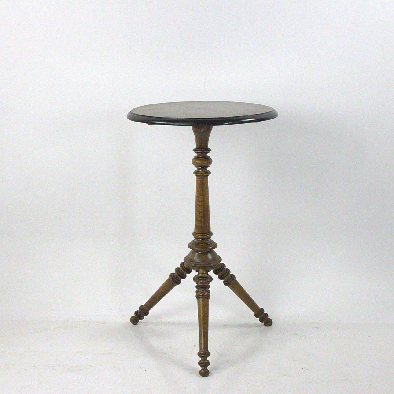 A three-legged pillar table, mahogany, Neo-Renaissance.