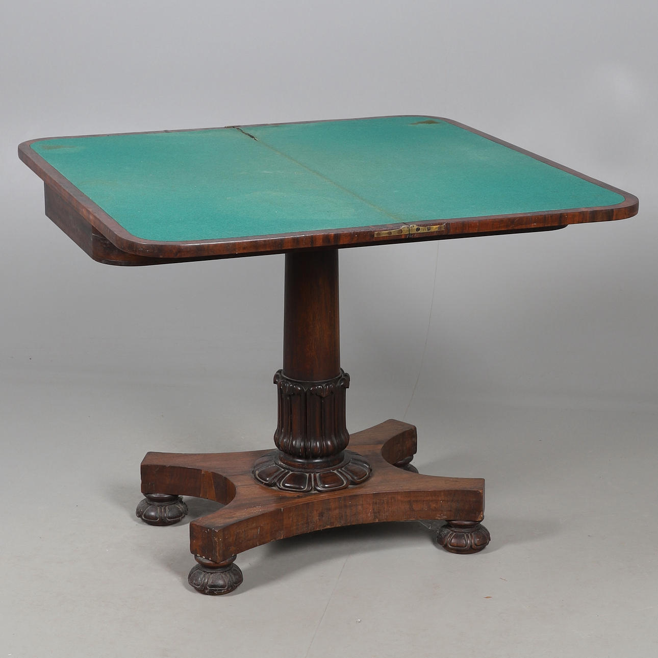 A ROSEWOOD FOLD OVER CARD TABLE.