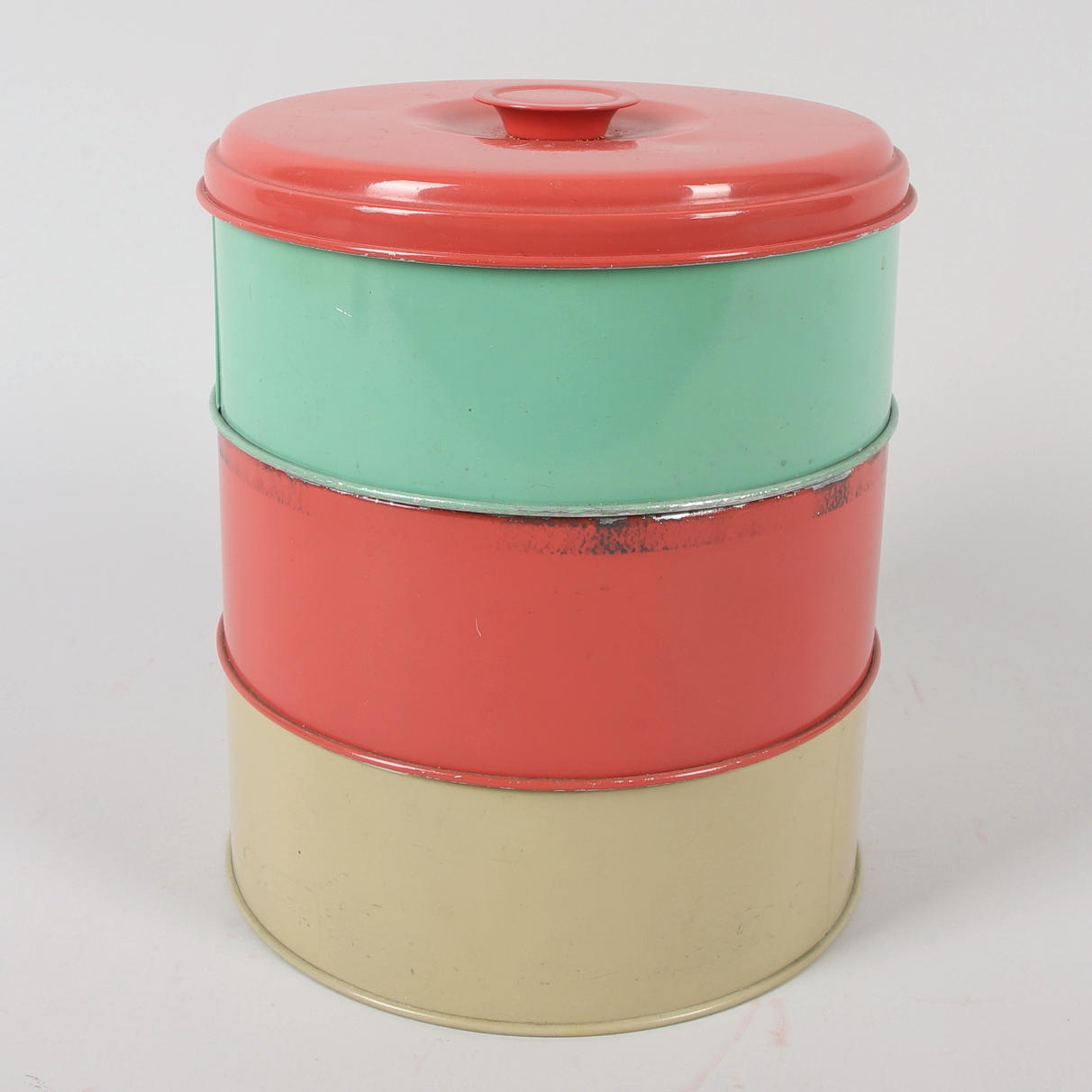 A 3-piece tin cookie jar, 20th century.