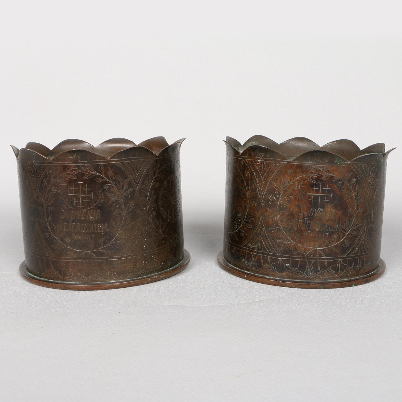 TWO TRENCH ART 'JERUSALEM' FLORALLY ENGRAVED PART SHELL HOLDERS (2).