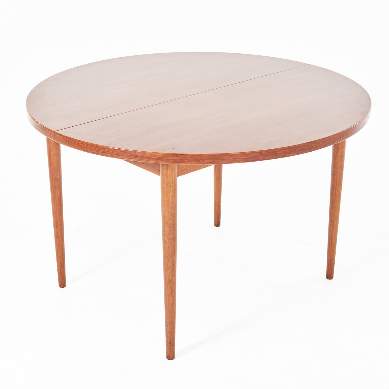 A mid 20th century dining table, solid teak, with insert top.