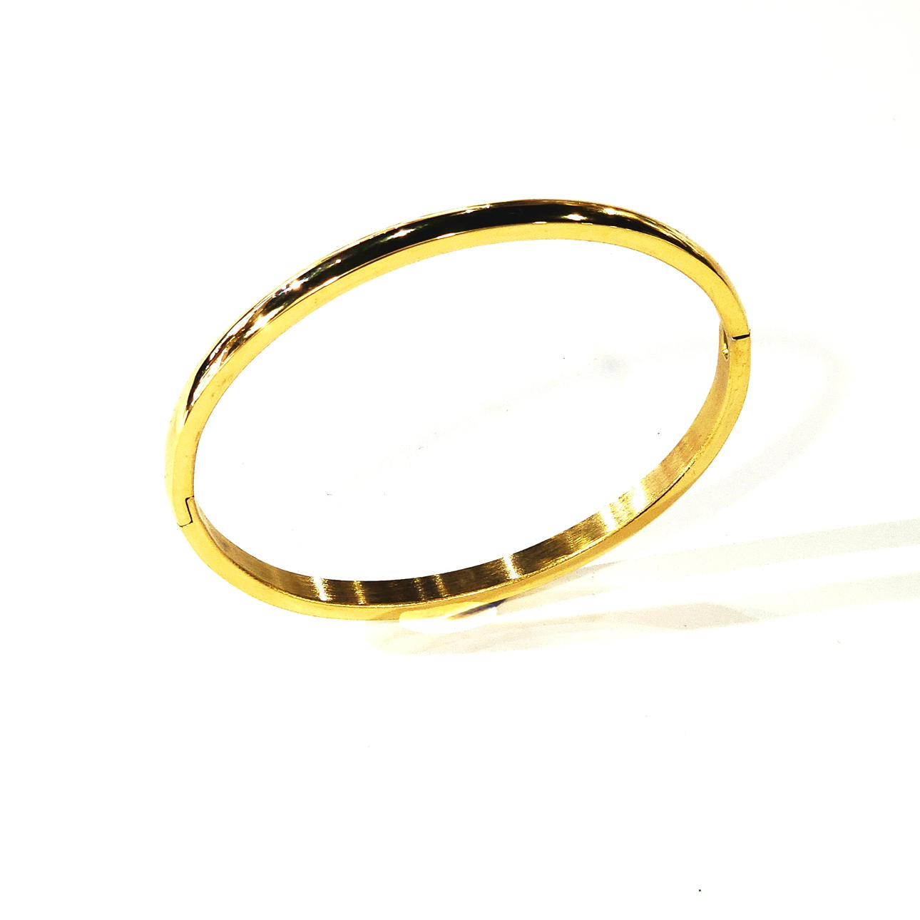 Slave bracelet in gold steel.