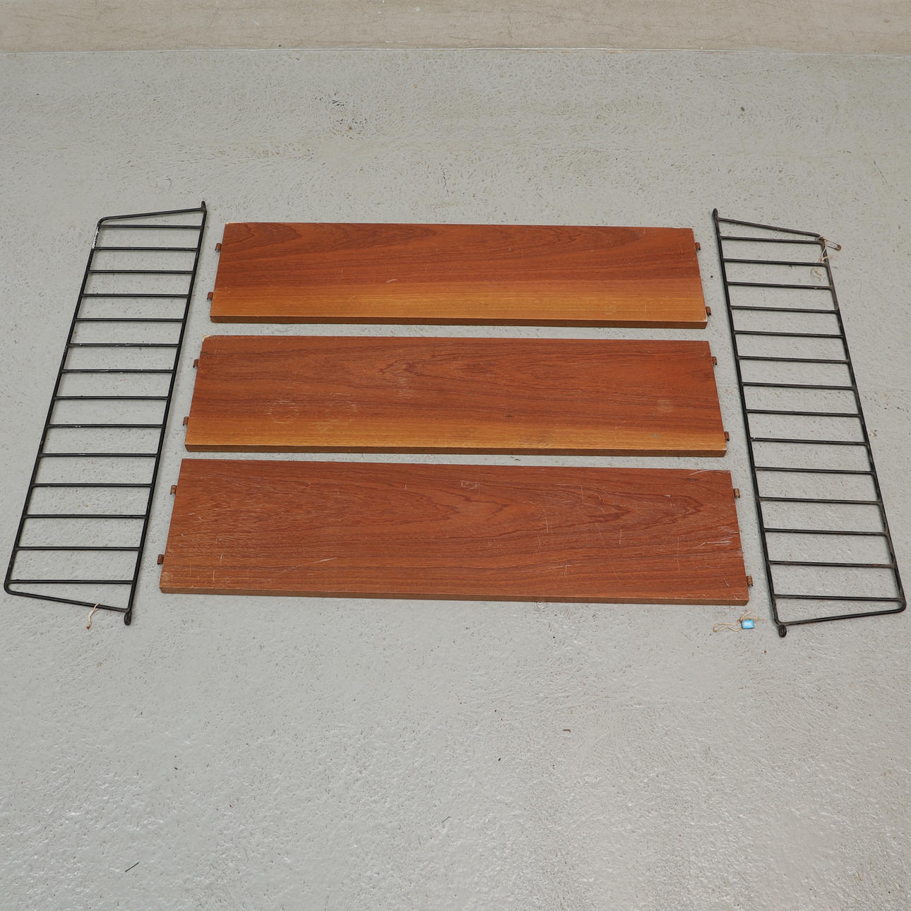 A five-piece original teak veneer string shelf, 1950's.