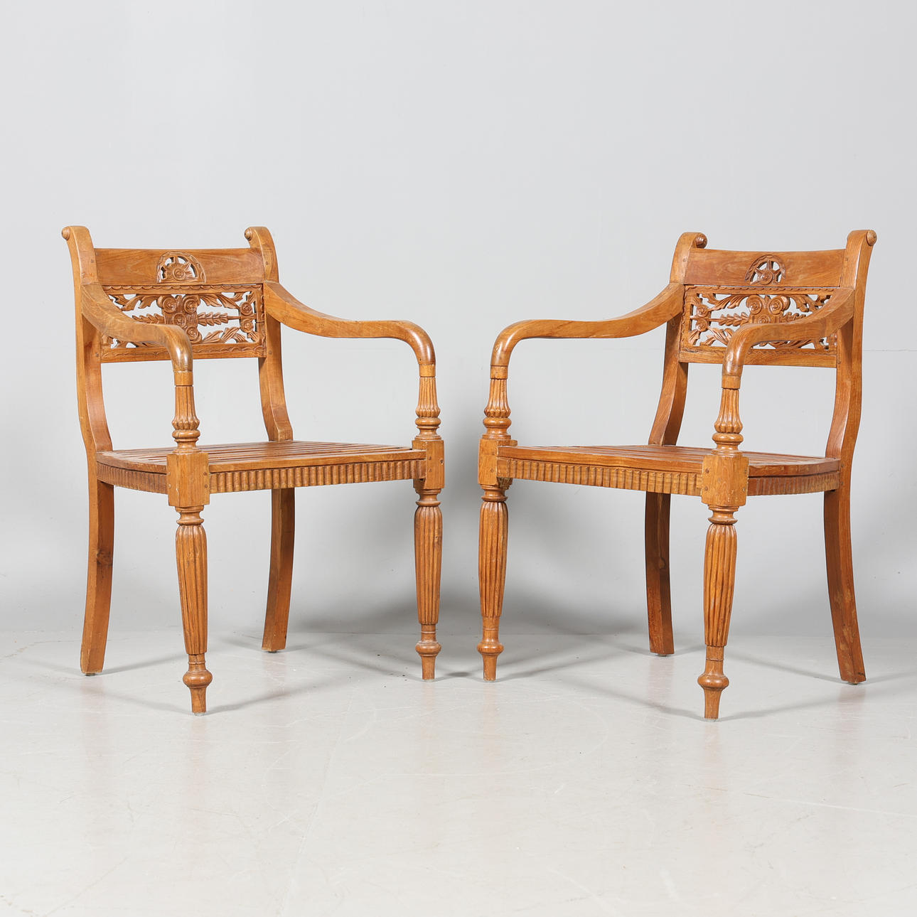 Armchairs pair with ribbed seat.