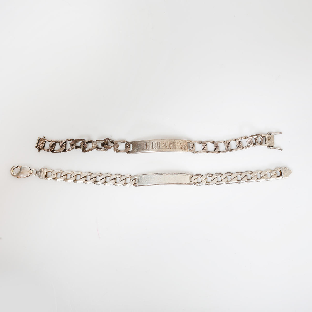 TWO SILVER ID BRACELETS (2).