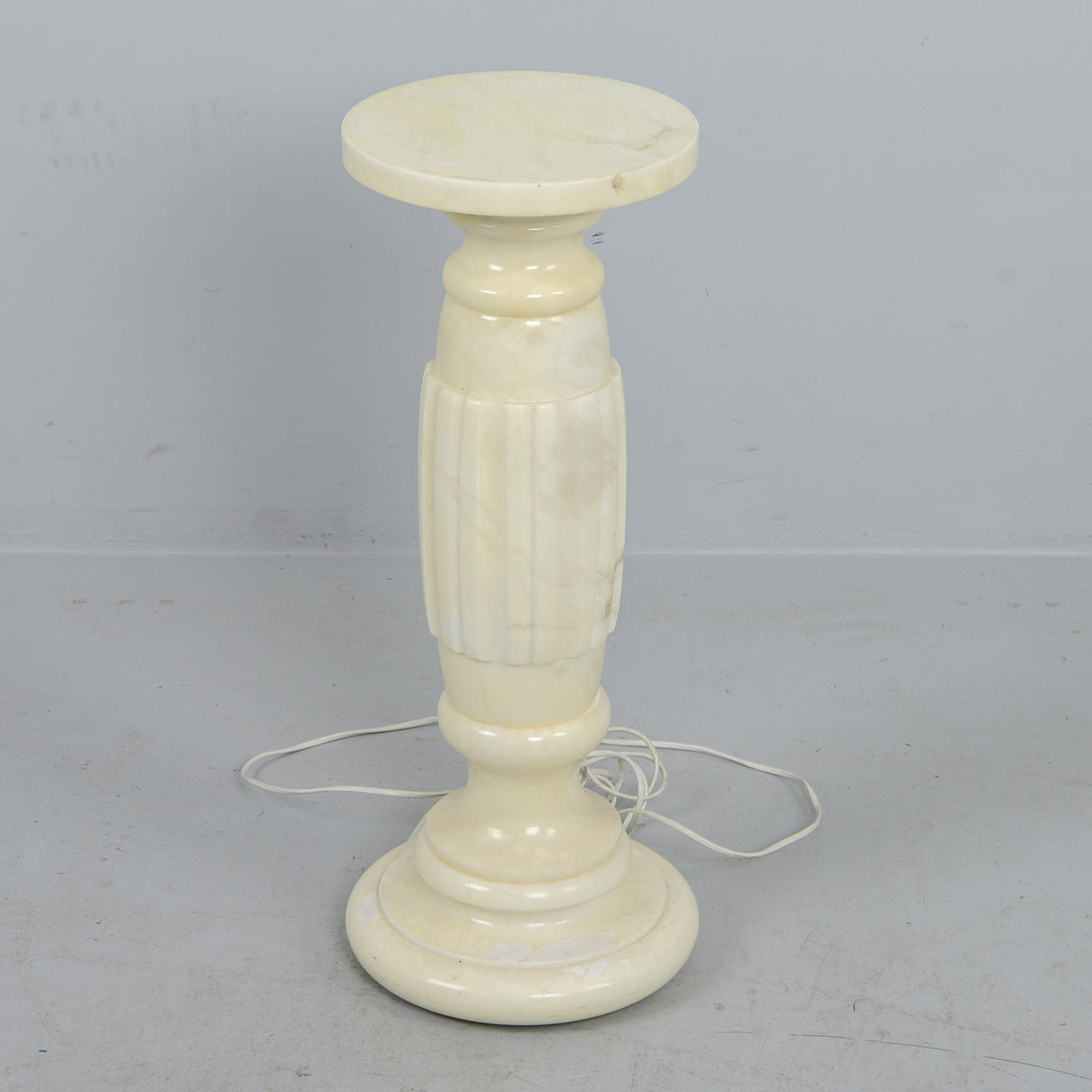 PEDESTAL with interior lighting, marble, 20th century.