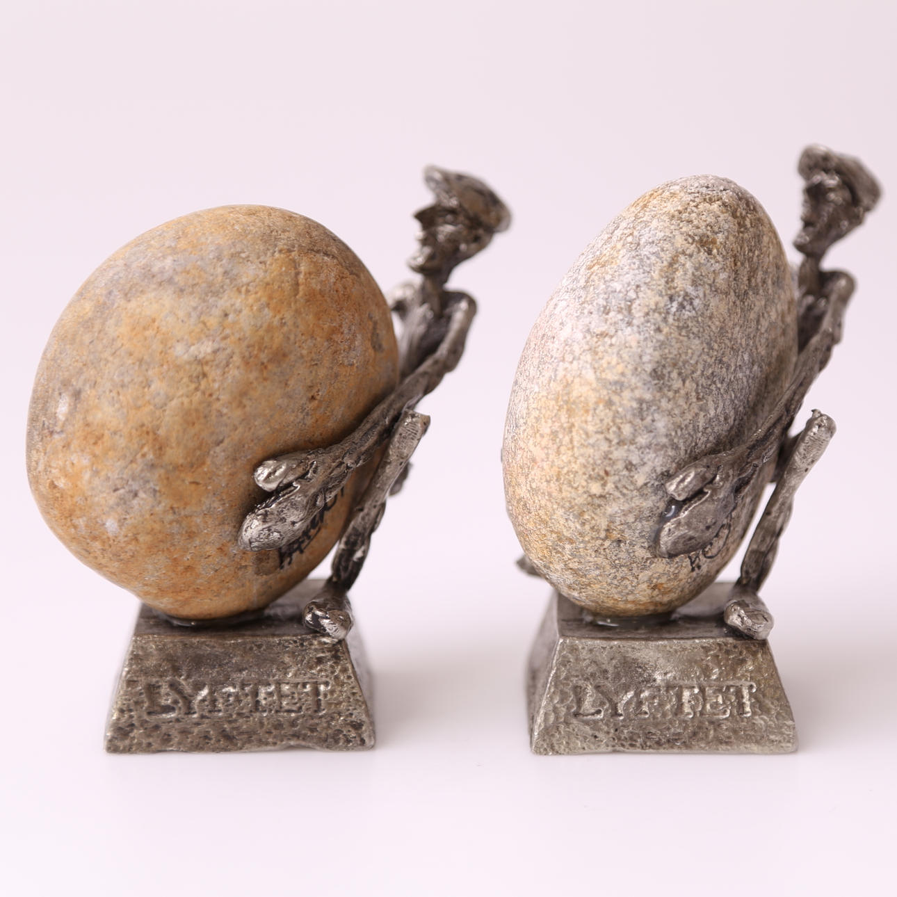 HENRY GUSTAFSSON. SKULPTURER, ett par snarlika, tenn & sten, "LYFTET", Henry Gustafsson, 1990-tal.