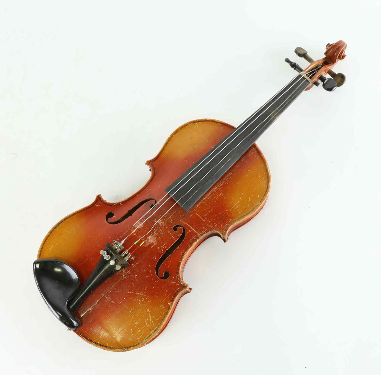 A mid 20th century Stradivarius violin and 2 strings.