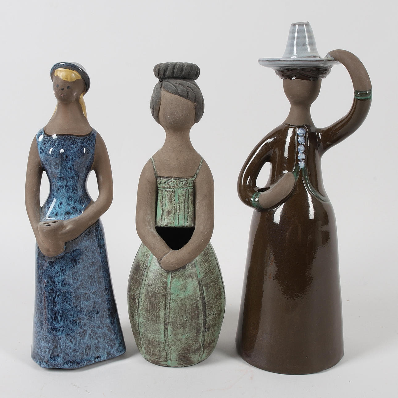 A set of 3 glazed ceramic figurines, including Elbogen, Jie.